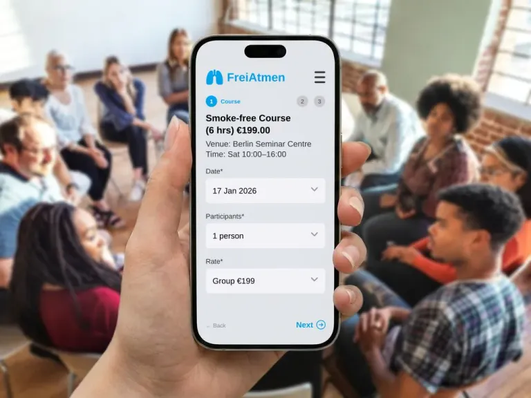 Phone showing a booking form in front of a discussion group in a bright seminar room