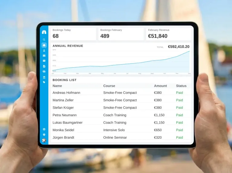 Tablet showing a booking dashboard in front of a bright marina scene